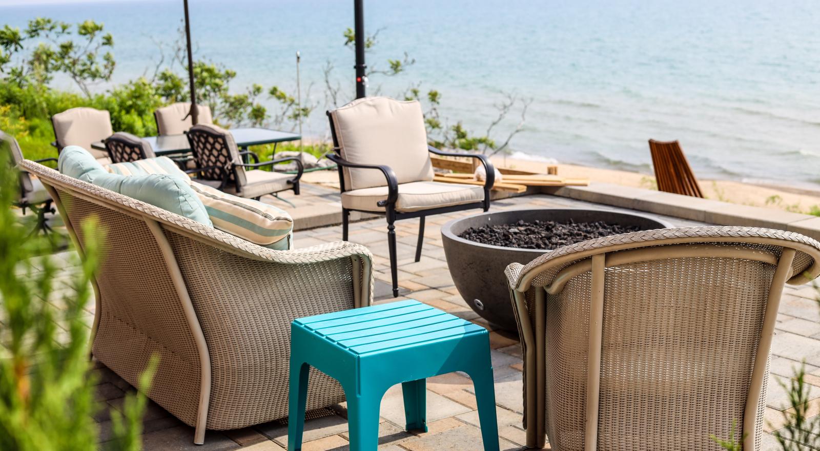 Multi-level patio with fire cauldron and dining area