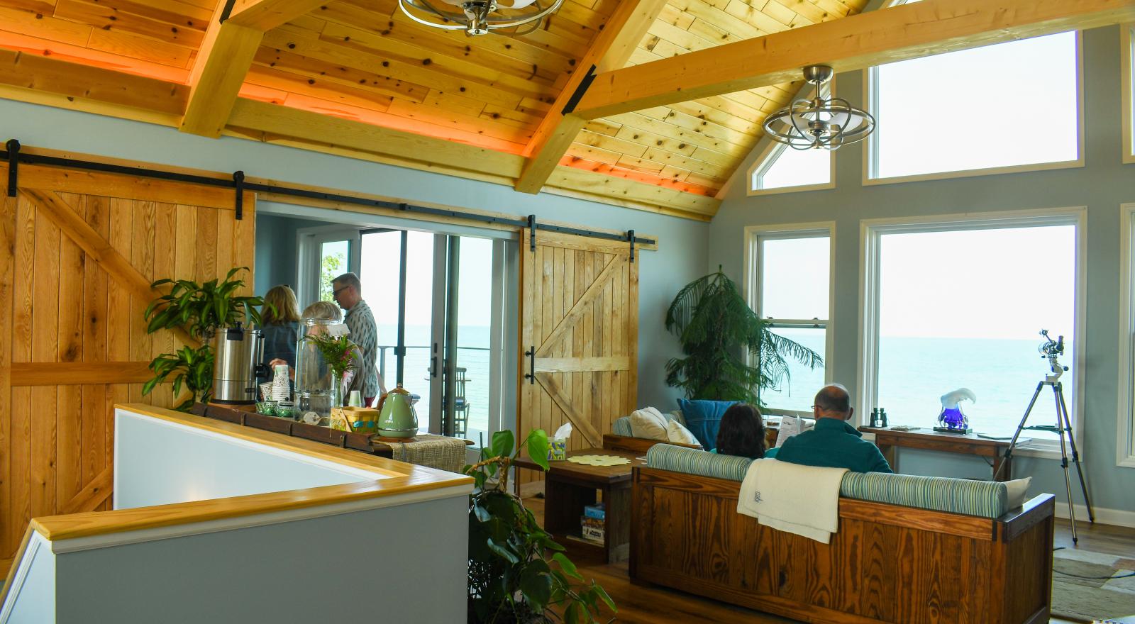 Great Room with barn doors open to dining room